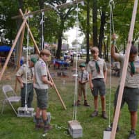 <p>Darien Boy Scouts demonstrate how to use pulleys to lift heavy objects at the Camporee</p>