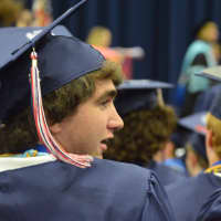 <p>A happy graduate at the New Fairfield High commencement.</p>