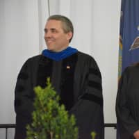 <p>Left to right: Somers Superintendent Raymond Blanch and school board President Sarena Meyer are among school district officials at the 2016 commencement</p>