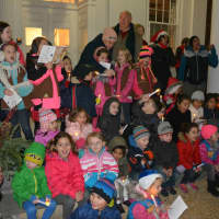 <p>A large group of kids gathers in front of village hall for Mount Kisco&#x27;s annual Christmas tree lighting.</p>