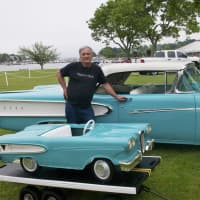 <p>Owner Roland R. Houde poses with his 1958 Edsel, and its mini promo. Only 14 of the minis were made, and just five are still around, according to Houde.</p>
