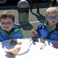 <p>The Country Club at Darien hosted the APTA men&#x27;s and women&#x27;s championships over the weekend. Two young boys enjoy their pizza.</p>