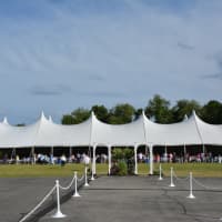 <p>A massive tent on the Primrose Elementary School field serves as the venue for Somers High School&#x27;s 2016 commencement.</p>