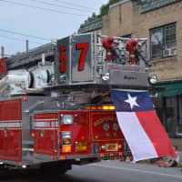 <p>A Texas state flag is flown from a Bedford Hills firetruck. Bedford Hills firefighters paid tribute to slain Dallas police who were killed in a shooting.</p>