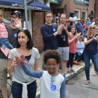 <p>Hillary Clinton supporters watch as the Democratic presidential candidate marches in her hometown parade in downtown Chappaqua.</p>