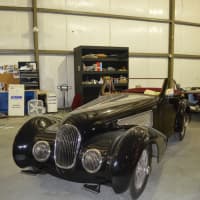 <p>Workers are putting the finishing touches on this vintage car at Redline Restorations in Bridgeport.</p>
