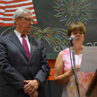 <p>Pawling High School Principal Helen Callan , right, speaks at the 2016 commencement while Pawling Schools Superintendent William Ward looks on.</p>