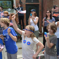 <p>Kids with Hillary Clinton campaign stickers watch the local Memorial Day parade in downtown Chappaqua. Clinton, a Democratic presidential candidate, is a Chappaqua resident.</p>