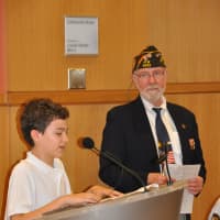 <p>Matthew Bergwall, an 8th Grade student at Middlesex Middle School in Darien reads his winning poem &quot;For Me,&quot; during the indoor ceremony at the Darien Library following the Memorial Day Parade.</p>
