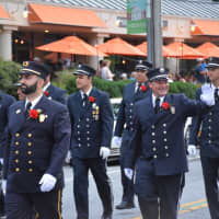 <p>Firefighters from Westerly, R.I. march in the Mount Kisco Fire Department&#x27;s parade. The Westerly firefighters brought along a pair of antique trucks.</p>