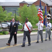 <p>Darien Memorial Day Speaker Brian O&#x27;Malley and Parade Grand Marshal, Len Hunter lead Post 6933 Honor Guard, Selectmen, and townspeople from the Darien Library Community Room to place wreaths honoring veterans at Spring Grove Veterans Memorial statue.</p>