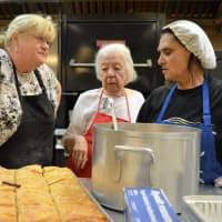 <p>Conferring in the kitchen are, from the left, Margaret Klarer of Dumont, Maria Filler of Tenafly, and Sabah Aboueid of Paramus.</p>