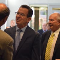 <p>Gov. Dannel Malloy attends the ribbon cutting for Conair facility in Stamford on Monday.</p>
