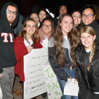 <p>Students gather outside at WestConn&#x27;s Midtown campus in Danbury. They walked around the quad chanting and waving signs to raise awareness to stop domestic and sexual abuse violence.</p>