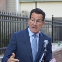 <p>Gov. Dannel Malloy speaks at a press conference in Norwalk on Monday on enhanced bus service.</p>