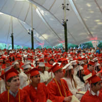 <p>Fox Lane High School graduates form a sea of red and white in the audience for the 2016 commencement.</p>
