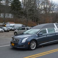 <p>A hearse containing Lois Colley&#x27;s casket is driven from St. James Episcopal Church in North Salem following the slain socialite&#x27;s funeral. The hearse is pictured en route to a nearby cemetery for a burial service.</p>