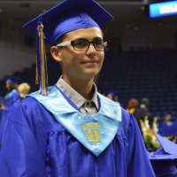 <p>A proud graduate of Warren Harding High School at the graduation on Tuesday at the Webster Bank Arena.</p>