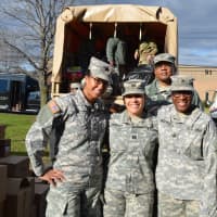 <p>Margarita Urgiles, center, of Wallington, and military members helped load gifts into trucks for the Bergen County PBA&#x27;s 27th Annual Toy Drive.</p>