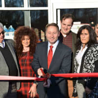 <p>Westchester County Executive Rob Astorino cuts the ribbon at the opening of DeCicco &amp; Sons in Millwood.</p>