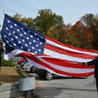 <p>A final lowering of the American flag is held at the old Millwood firehouse, a key marker of the station&#x27;s decommissioning.</p>