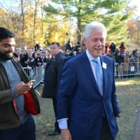 <p>Hillary and Bill Clinton head out from the grounds of Douglas G. Grafflin Elementary School in Chappaqua after casting their presidential votes and meeting with supporters.</p>
