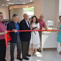 <p>Soyoun Chung cuts the ribbon on her new fashion boutique in Fort Lee.</p>