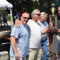 <p>Shelton Mayor Mark Lauretti hands the trophy to Bob Sabre, with his 1958 Chevy Impala, the lucky winner of the Mayor’s Trophy at Sunday&#x27;s classic car show.</p>