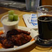 <p>Wings and beer served at Holy Smoke in Mahopac.</p>