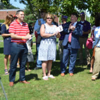 <p>Danbury residents, along with State Rep. Dan Carter, attend the ceremony on Sunday morning.</p>