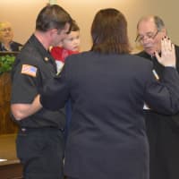 <p>Kellie Goodell is sworn in by MunicipalJudge Vincent Galasso, accompanied by her brother, Gregory Goodell, Jr., and 3-year-old nephew, Jaxon.</p>