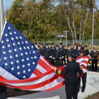 <p>The American flag is unfurled and raised on the grounds of the new Millwood firehouse.</p>