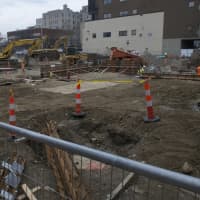 <p>The lot is torn up as work continues on expansion of Lafayette Hall at Housatonic Community College in Bridgeport.</p>