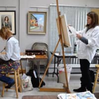 <p>Diane Ventura of Allendale, left, and Margery Honig of Saddle River hard at work.</p>