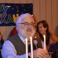 <p>Rabbi Yehoshua Hecht lights the menorah at Stew Leonard&#x27;s in Norwalk Monday.</p>