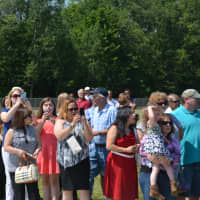 <p>Onlookers gather for the march of Webutuck High School&#x27;s Class of 2016 to their commencement.</p>