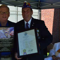 <p>Danbury&#x27;s Mayor Mark Boughton and State Commander John A. Kwiatkowski hold up their plaques of dedication for those who have earned the Purple Heart.</p>