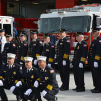 <p>Millwood firefighters pose for photos in front of their new firehouse.</p>