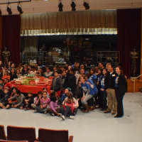 <p>Newfield Elementary School students pose in front of holiday gifts that will be given to families in need through Stamford&#x27;s Neighbors Link program. </p>