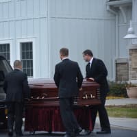 <p>Pallbearers move Frances Ghelarducci&#x27;s casket into a hearse following her funeral at St. Joseph&#x27;s Church in Somers.</p>