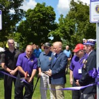 <p>The ribbon-cutting is performed by Dan Hayes, Lee Teicholz, John Kwiatkowski, Lt. Col. Michael Zacchea, and Mayor Mark Boughton, marking the official Purple Heart parking spots at the War Memorial in Danbury.</p>