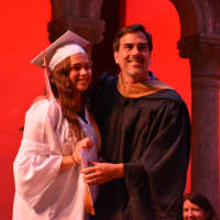 <p>Fox Lane High School 2016 graduate Alicia Bracco receives a diploma from her father, Bedford Central school board member Andrew Bracco.</p>