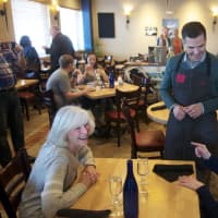 <p>County Executive Marcus Molinaro chats with diners at Bluestone Bistro.</p>