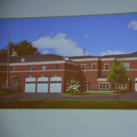 <p>A photo of a rendering of the proposed Chappaqua firehouse expansion, which is pictured on the right side of the image.</p>