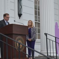<p>Stratford Mayor John Harkins speaks at a vigil for Domestic Violence Awareness Month as Deb Greenwood, president of the Center or Family Justice, looks on.</p>