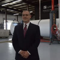 <p>Charlie Dippilito Jr. standing in his new medical waste processing facility, Future Healthcare Systems of Bridgeport.</p>