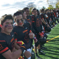 <p>The game&#x27;s Most Outstanding Back, Chris Corrado (4), and the Tigers stand at midfield Saturday, waiting to receive their winner&#x27;s trophy.</p>