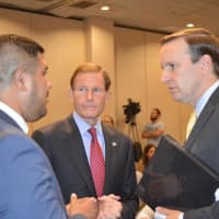 <p>State Rep. Chris Rosario, left, speaks with U.S. Sens. Richard Blumenthal and Chris Murphy.</p>