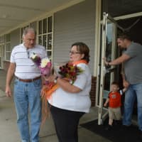 <p>Raeann McLaren, right, presents Zoeli Farkas with two free bouquets, courtesy of City Line Florist in Trumbull.</p>