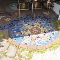 <p>A mosaic in front of the garage.</p>